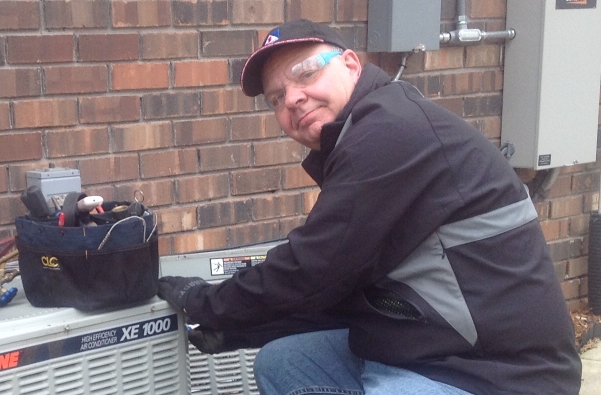 A picture of Bob working on an AC unit